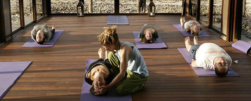 People doing yoga at Paradis Plage